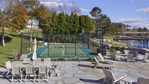 The sport court with seating and amenities displayed on a sunny day
