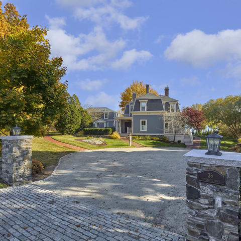 Howells House entrance, privately nestled past a stone driveway
