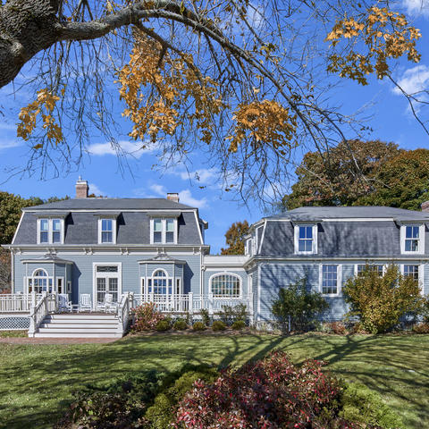 Howells House backyard view with a focus on the home situated on a serene private yard