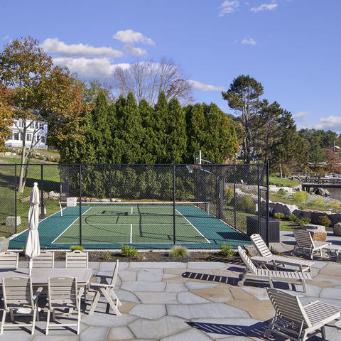 The sport court with seating and amenities displayed on a sunny day