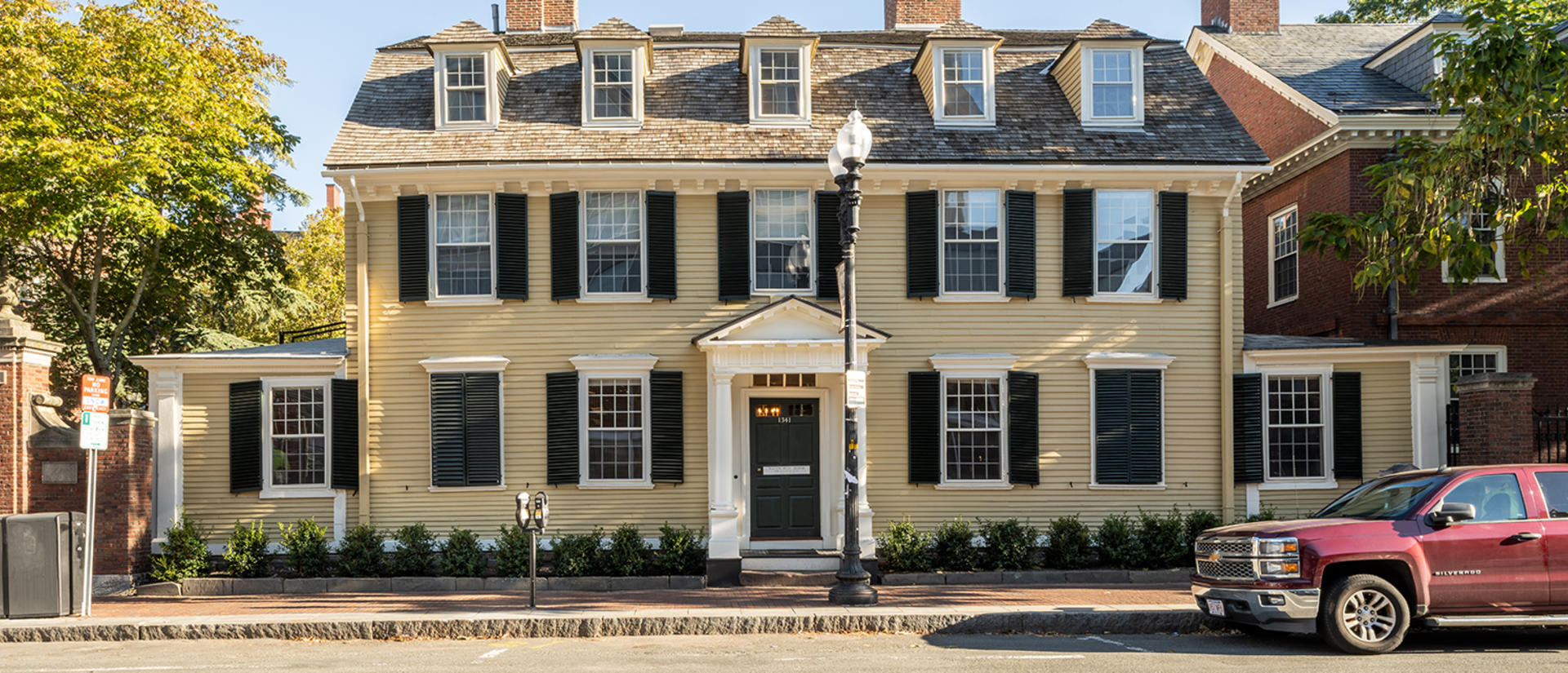 The front of Wadsworth house, facing the street on a sunny afternoon